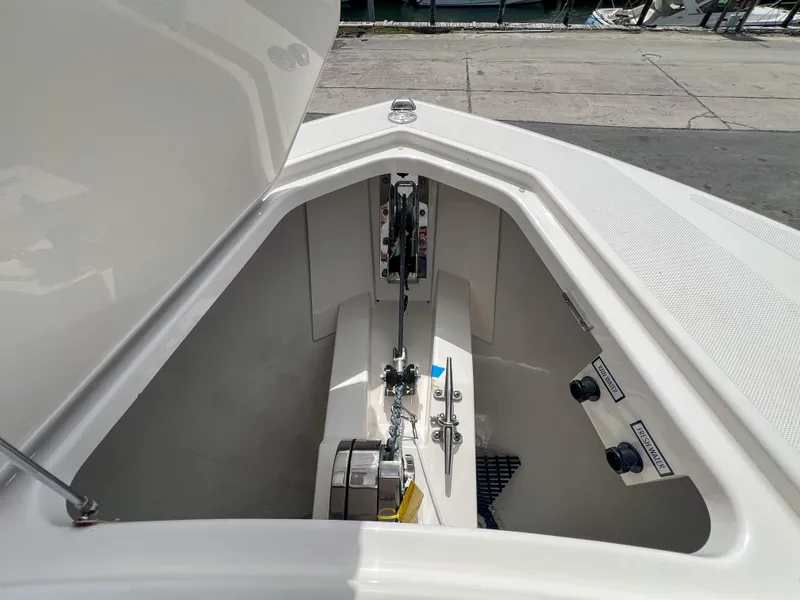 Slide: The Image of 2023 Tiara Yachts 38 LS anchor compartment with chain and controls. - 6