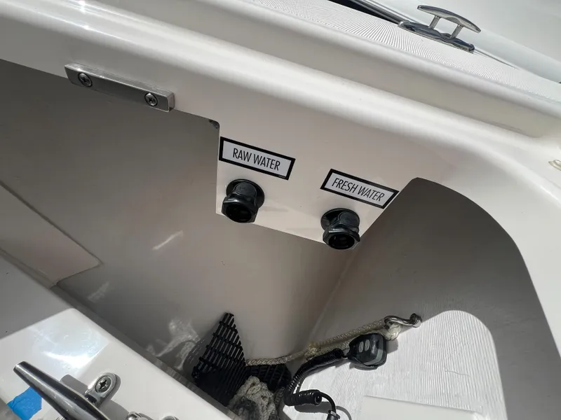 Slide: The Image of 2023 Tiara Yachts 38 LS water connections labeled "Raw Water" and "Fresh Water." - 7