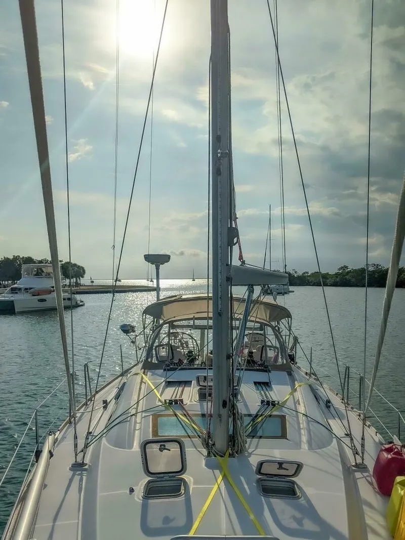 Slide: The Image of 2008 Beneteau Oceanis 43 sailboat on calm water under a bright sky. - 2
