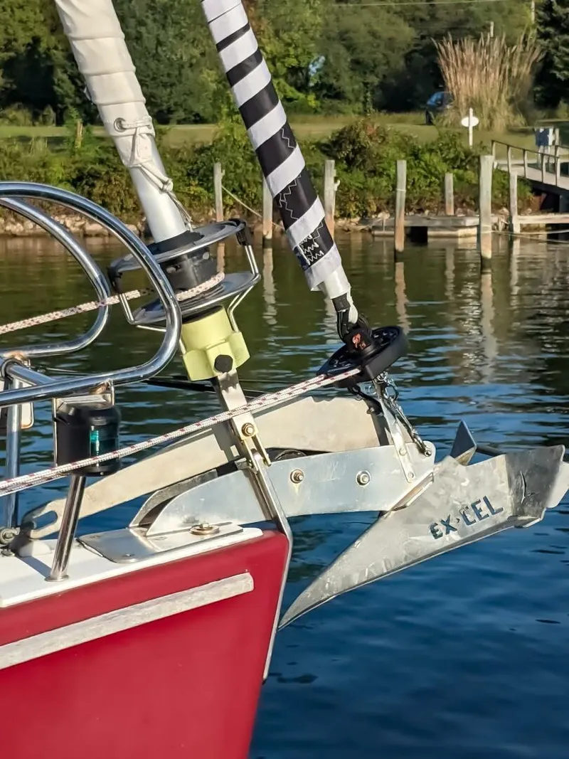 Slide: The Image of Close-up of a 2008 Beneteau Oceanis 43 sailboat anchor in a serene marina. - 5