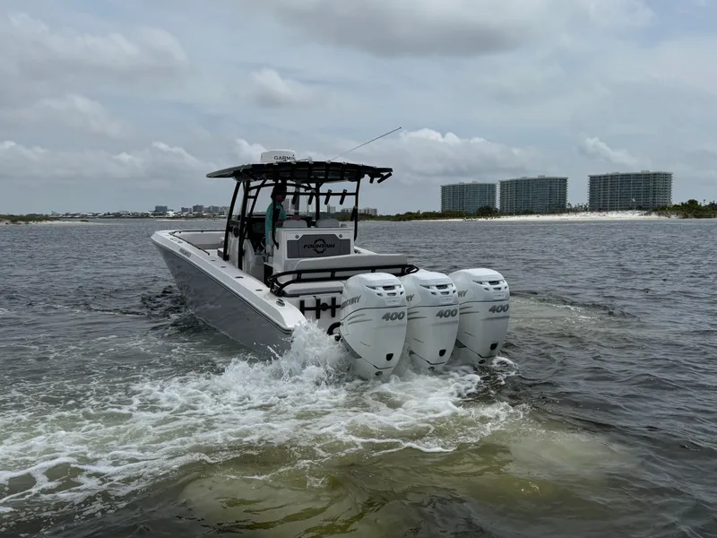 Slide: The Image of Fountain 38TE boat with triple 400 engines cruising on water, 2022 model. - 12