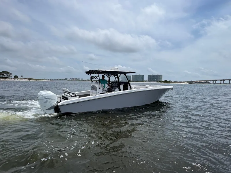 Slide: The Image of 2022 Fountain 38TE boat cruising on open water under a cloudy sky. - 18