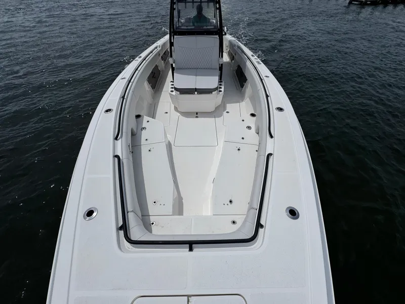 Slide: The Image of 2022 Fountain 38TE boat on water, showcasing sleek design and spacious deck. - 21