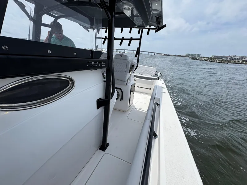 Slide: The Image of 2022 Fountain 38TE boat on water, featuring sleek design and spacious deck. - 27