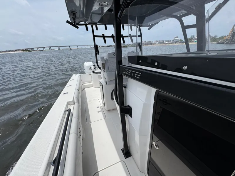 Slide: The Image of 2022 Fountain 38TE boat on water, showcasing sleek design and spacious deck. - 28
