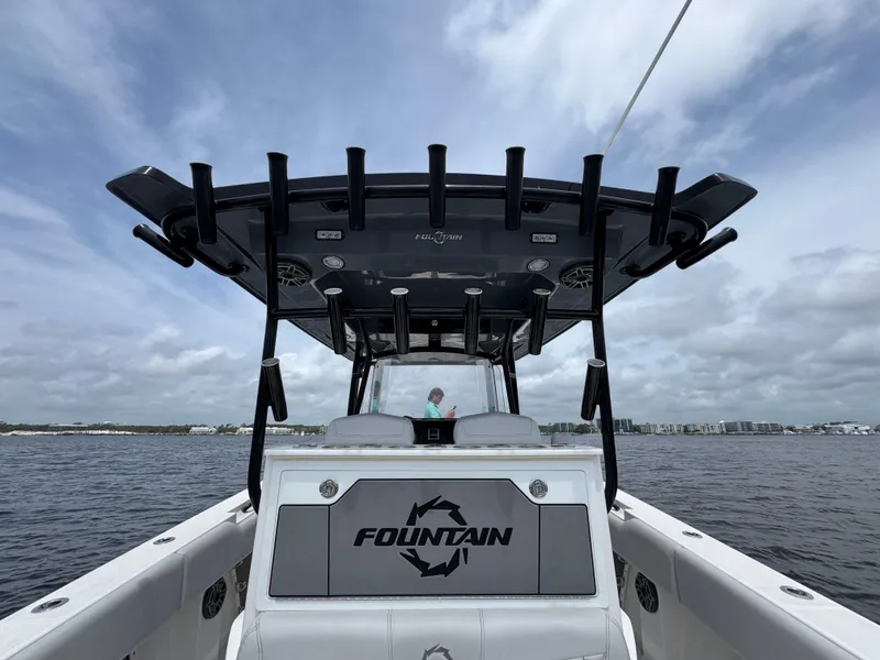 Slide: The Image of 2022 Fountain 38TE boat on water, featuring sleek design and spacious deck. - 36