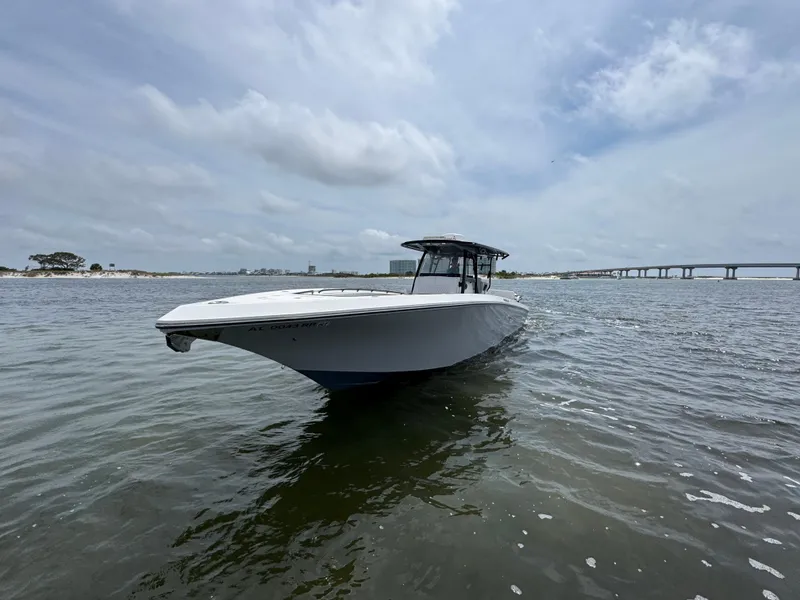 Slide: The Image of 2022 Fountain 38TE boat on calm water under cloudy sky. - 6