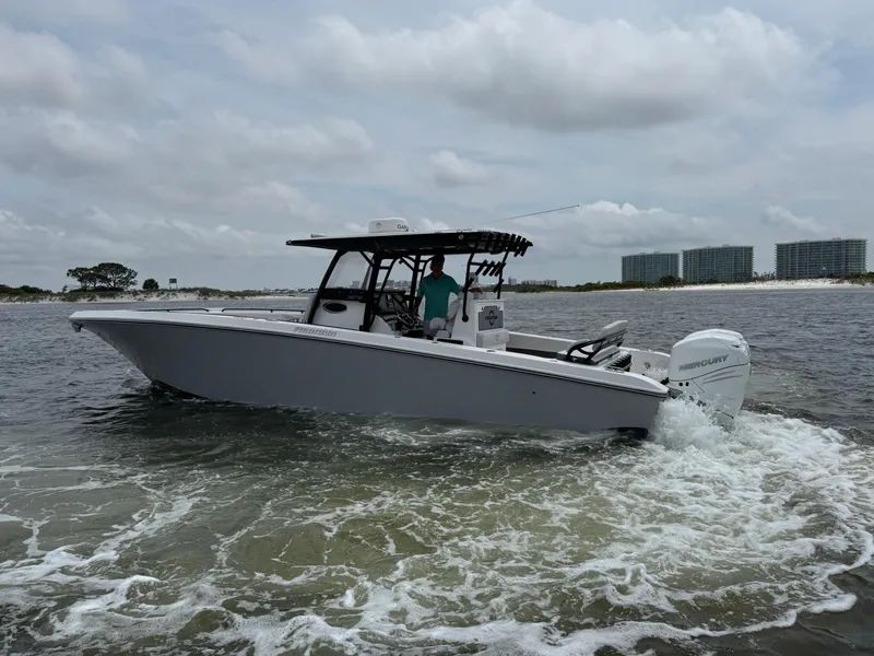 Slide: The Image of 2022 Fountain 38TE boat cruising on water under cloudy skies. - 9