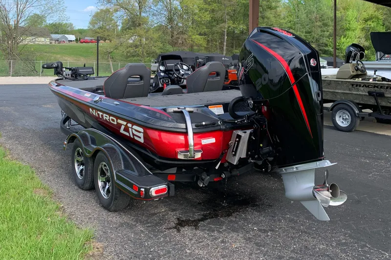 Slide: The Image of 2019 Nitro Z19 Pro boat with powerful outboard motor, parked on a trailer. - 3
