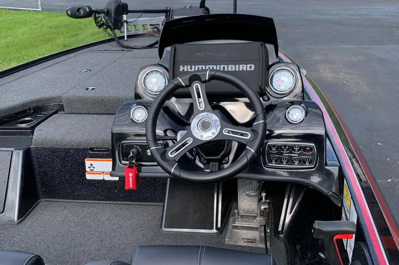 Slide: The Image of 2019 Nitro Z19 Pro boat dashboard with steering wheel and Humminbird electronics. - 5