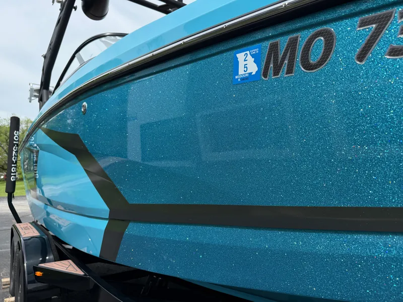 Slide: The Image of 2022 Heyday WT-2DC boat with sparkling blue finish and Missouri registration. - 11