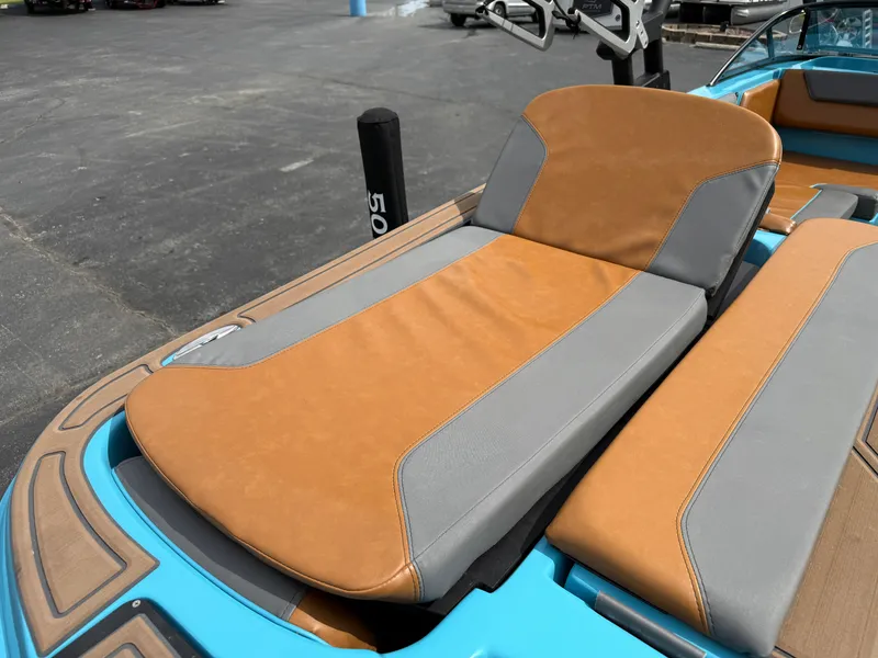 Slide: The Image of 2022 Heyday WT-2DC boat with tan and gray seating on a blue deck. - 14