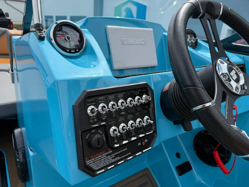 Slide: The Image of Control panel of a 2022 Heyday WT-2DC boat with steering wheel and gauges. - 18