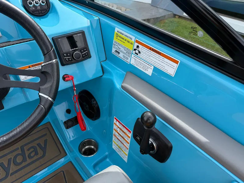 Slide: The Image of Interior of 2022 Heyday WT-2DC boat with blue dashboard and control panel. - 19