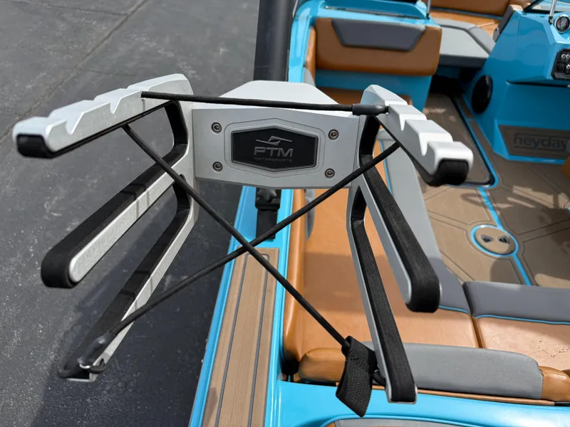 Slide: The Image of 2022 Heyday WT-2DC boat with PTM wakeboard rack, blue and tan interior. - 25