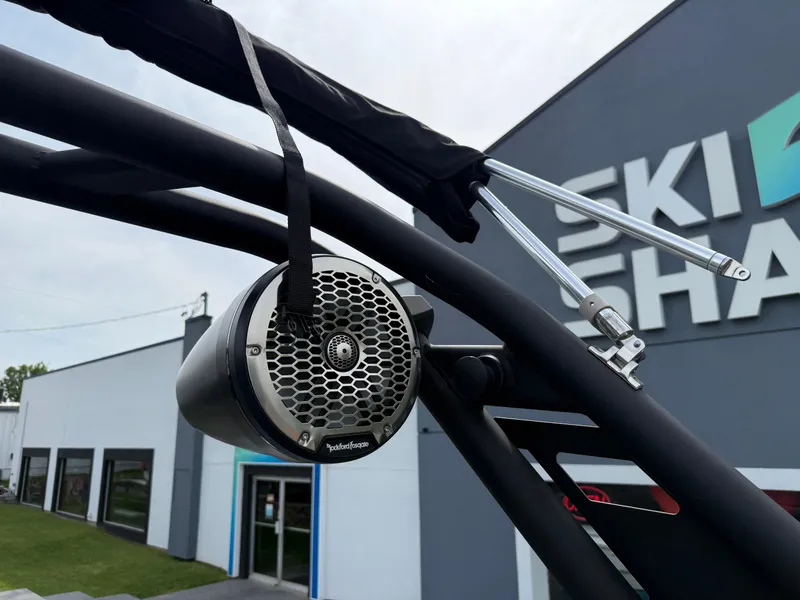 Slide: The Image of 2022 Heyday WT-2DC boat speaker mounted on a black frame near a building. - 27