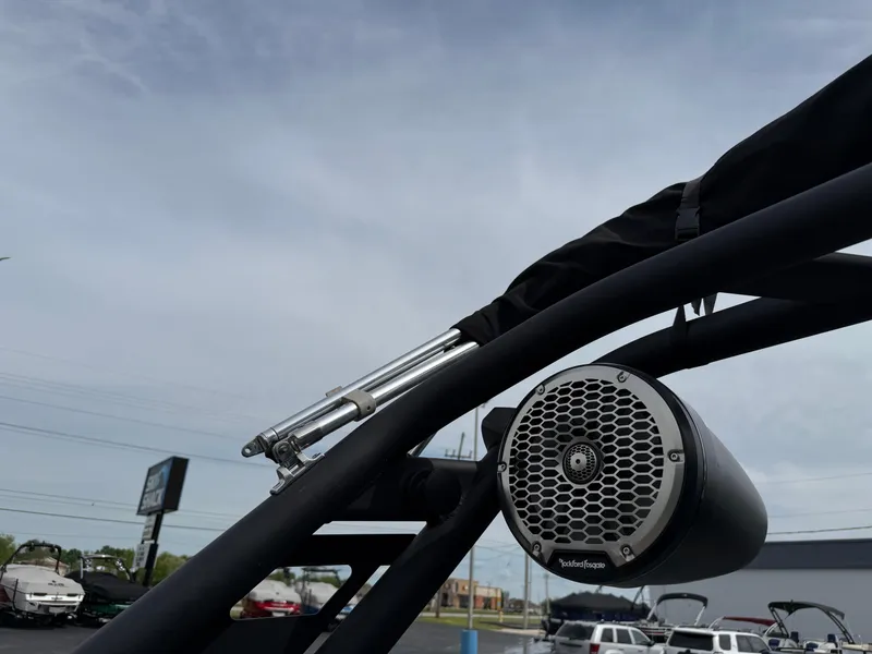 Slide: The Image of 2022 Heyday WT-2DC boat with mounted Rockford Fosgate speaker, outdoor dealership setting. - 28