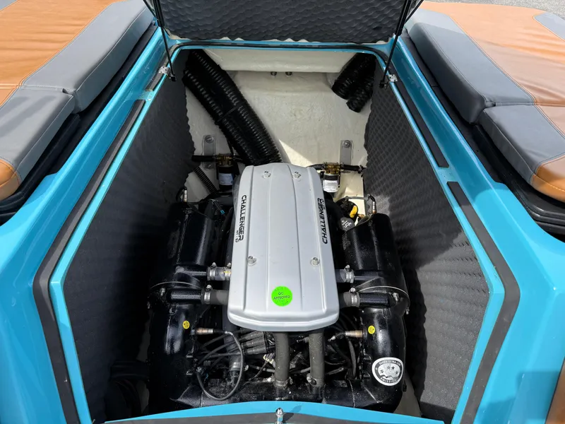 Slide: The Image of 2022 Heyday WT-2DC boat engine compartment with open hatch, showcasing engine details. - 29