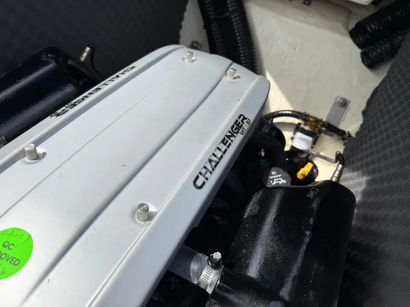 Slide: The Image of Engine compartment of 2022 Heyday WT-2DC boat featuring Challenger engine components. - 30