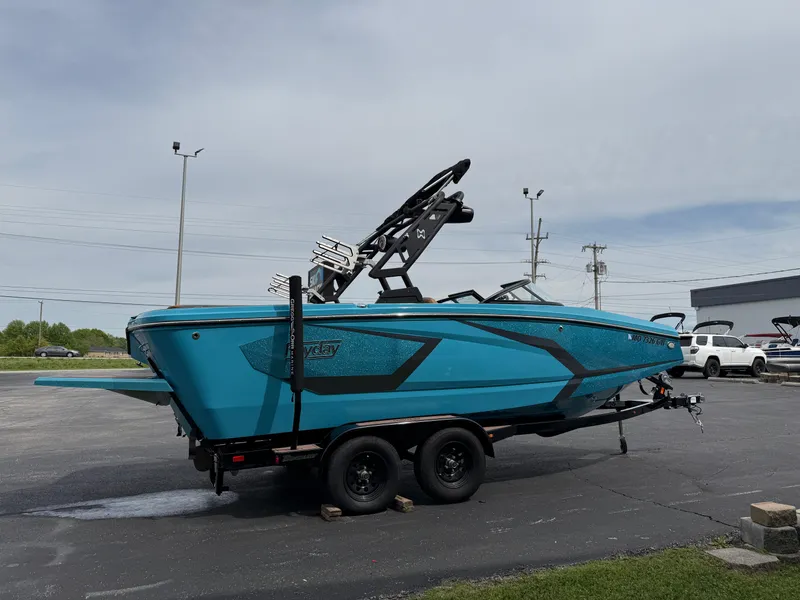 Slide: The Image of 2022 Heyday WT-2DC boat in vibrant blue on a trailer, parked outdoors. - 5