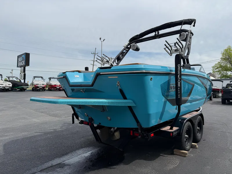 Slide: The Image of 2022 Heyday WT-2DC boat in vibrant blue on a trailer, parked outdoors. - 7