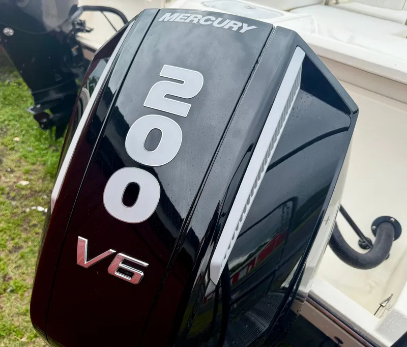 Slide: The Image of Mercury 200 V6 outboard engine on 2021 Cobia 220 Dual Console boat. - 15