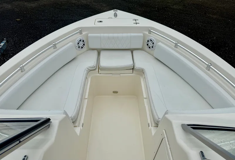 Slide: The Image of 2021 Cobia 220 Dual Console boat with spacious seating and sleek design. - 8