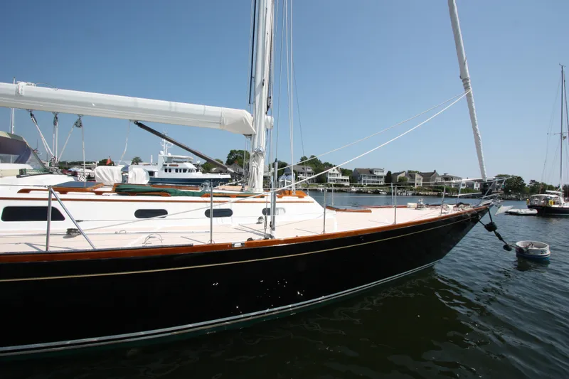 Slide: The Image of Hinckley Sou'wester 51 sailboat, 1993 model, docked in a sunny marina. - 12
