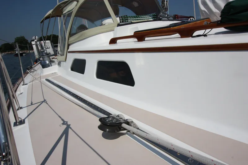 Slide: The Image of Hinckley Sou'wester 51 sailboat deck, 1993 model, featuring sleek design and polished wood accents. - 13