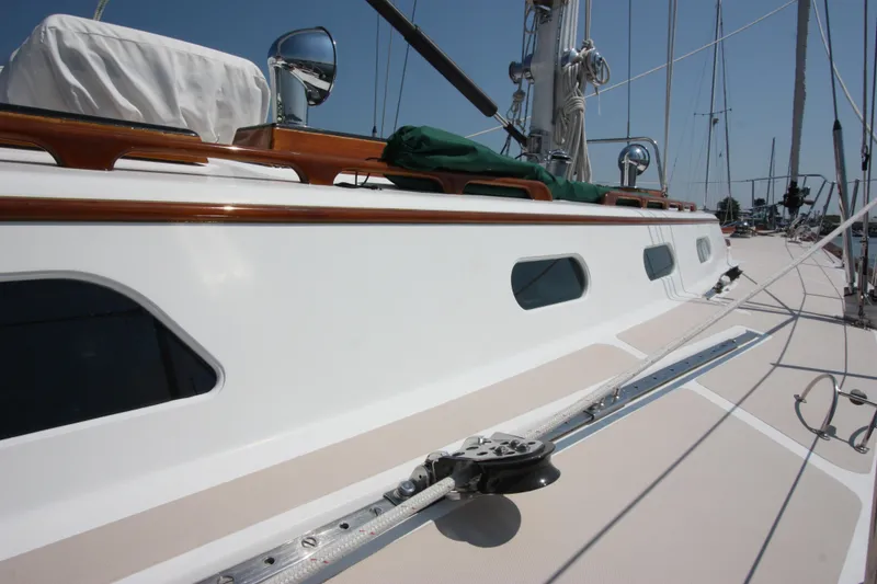 Slide: The Image of Hinckley Sou'wester 51 sailboat deck, 1993 model, featuring sleek design and polished wood accents. - 14