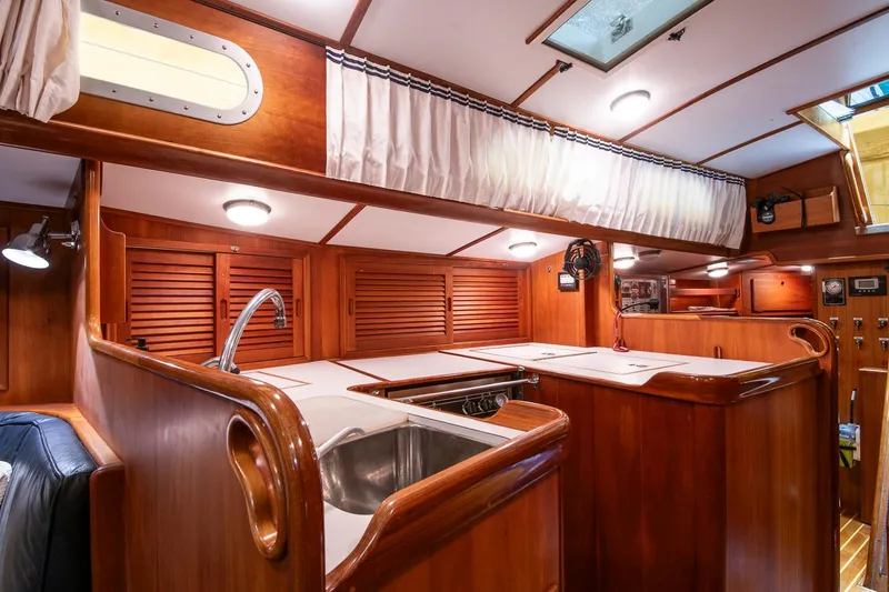 Slide: The Image of Interior of 1993 Hinckley Sou'wester 51 yacht with wooden cabinetry and modern amenities. - 26