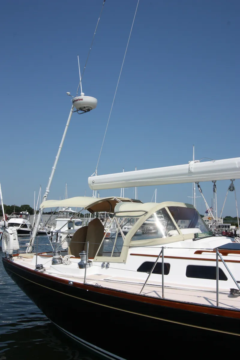 Slide: The Image of 1993 Hinckley Sou'wester 51 sailboat docked under clear blue sky. - 11