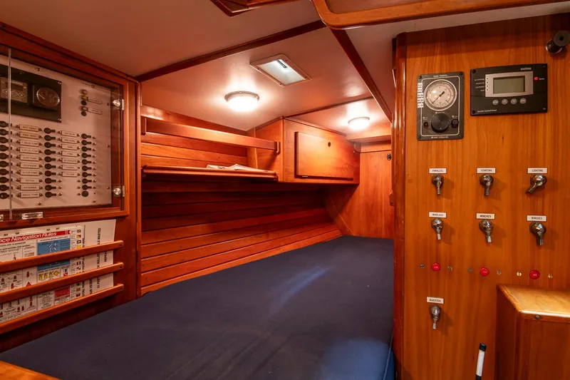 Slide: The Image of Interior of 1993 Hinckley Sou'wester 51 sailboat with wooden paneling and control panels. - 20