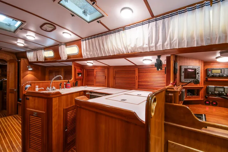 Slide: The Image of Interior of 1993 Hinckley Sou'wester 51 yacht, featuring elegant wood finishes and modern amenities. - 23
