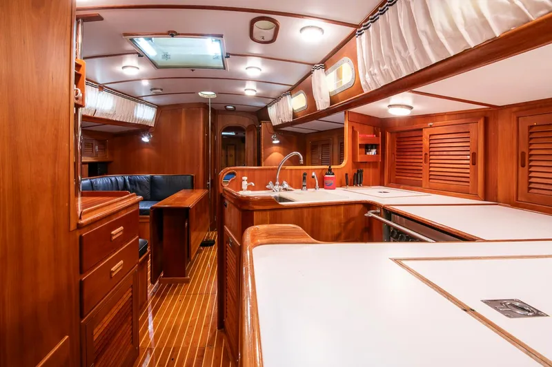 Slide: The Image of Luxurious interior of a 1993 Hinckley Sou'wester 51 yacht with wooden finishes and modern amenities. - 24