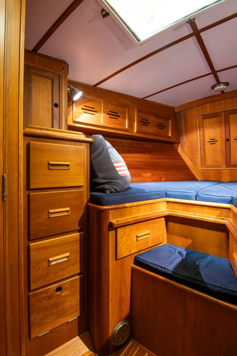 Slide: The Image of Cozy cabin interior of 1993 Hinckley Sou'wester 51 sailboat with wooden furnishings. - 45