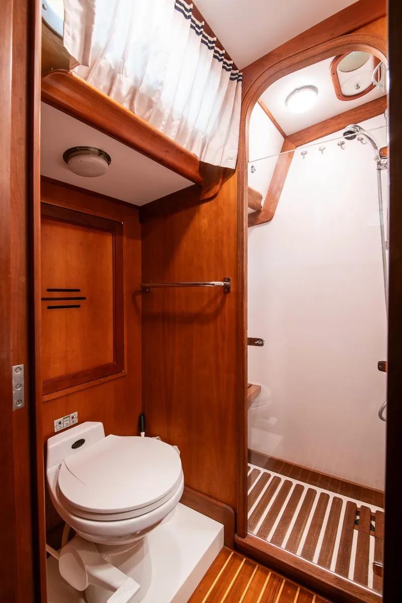 Slide: The Image of Hinckley Sou'wester 51 yacht bathroom, 1993 model, featuring wooden interior and shower. - 48