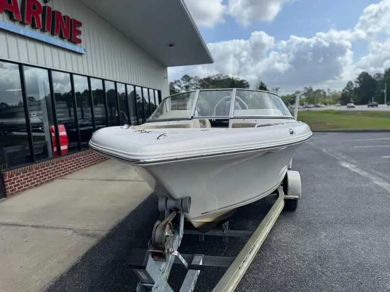 Slide: The Image of 2016 Key West 203 DFS boat on trailer outside marine dealership. - 1