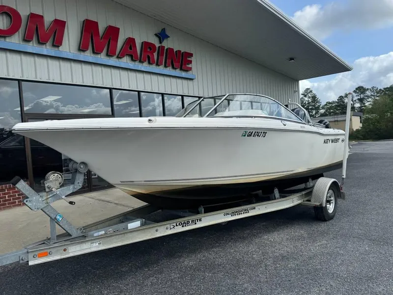 Slide: The Image of 2016 Key West 203 DFS boat on trailer outside marine dealership. - 2
