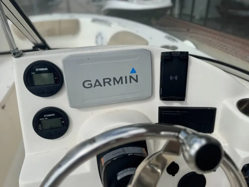Slide: The Image of 2016 Key West 203 DFS boat dashboard with Garmin navigation system and Yamaha gauges. - 3