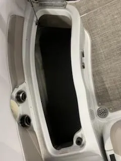 Slide: The Image of 2016 Crownline E4 boat storage compartment with open lid and visible interior. - 10