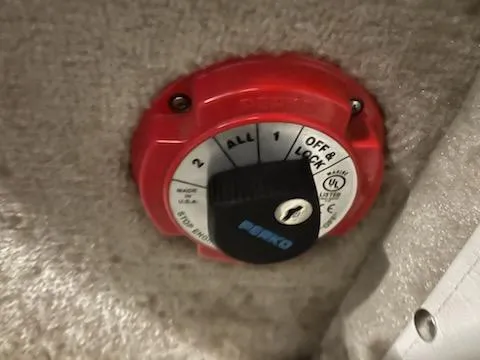 Slide: The Image of Red battery switch on a 2016 Crownline E4 boat, featuring multiple settings. - 11