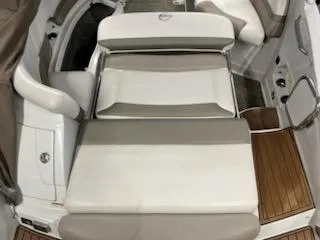 Slide: The Image of 2016 Crownline E4 boat interior with cushioned seating and teak flooring. - 15