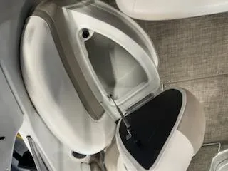 Slide: The Image of 2016 Crownline E4 boat storage compartment with open hatch, showcasing interior space. - 16