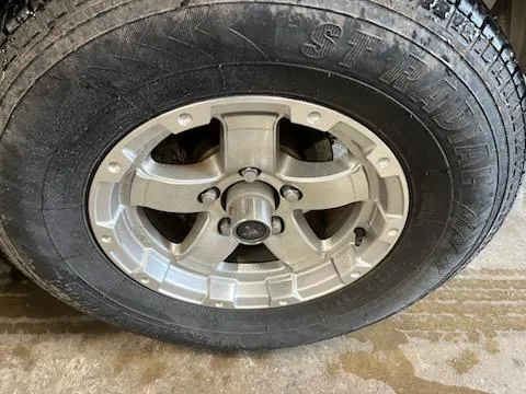 Slide: The Image of 2016 Crownline E4 wheel with Strada tire on concrete surface. - 9