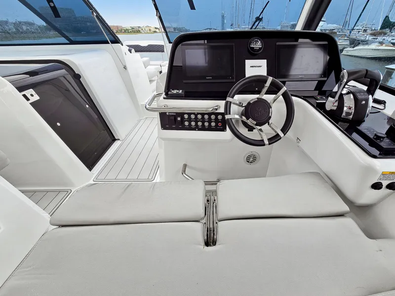 Slide: The Image of 2020 Aquila 36 Sport helm with modern controls and dual screens. - 10