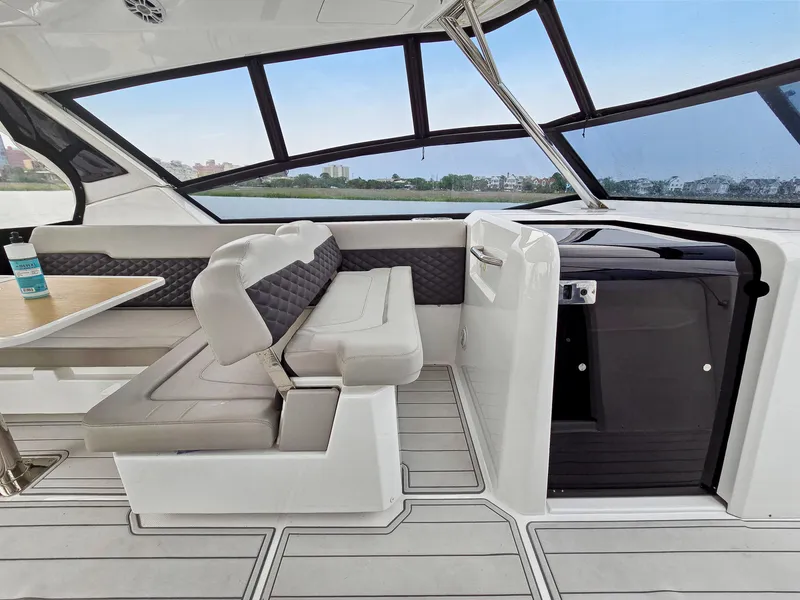 Slide: The Image of Interior of 2020 Aquila 36 Sport yacht with seating and table, featuring modern design. - 14