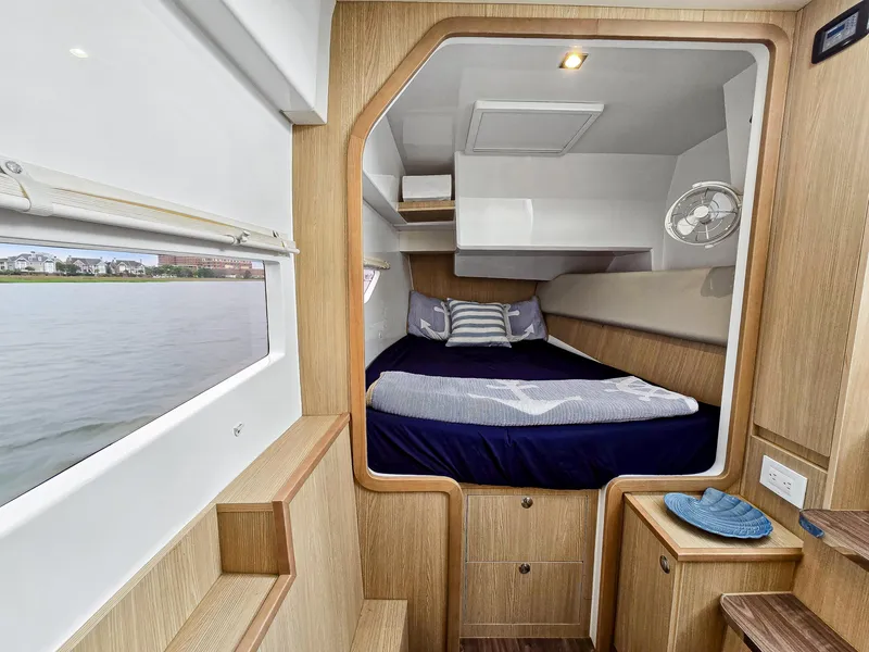 Slide: The Image of Cabin interior of 2020 Aquila 36 Sport yacht with bed and wooden finish. - 17