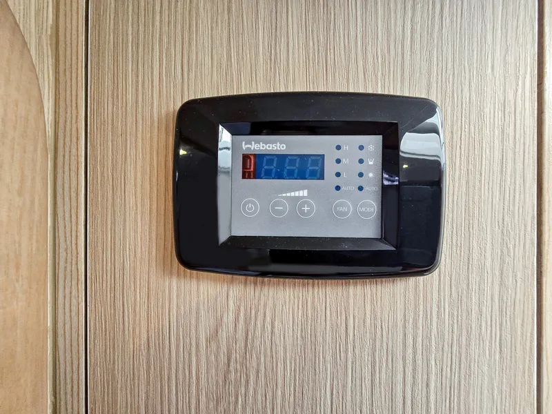 Slide: The Image of Thermostat control panel on Aquila 36 Sport 2020 boat interior. - 23