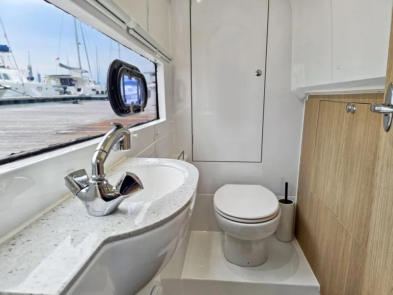 Slide: The Image of Modern bathroom in 2020 Aquila 36 Sport yacht with sleek fixtures and marina view. - 25